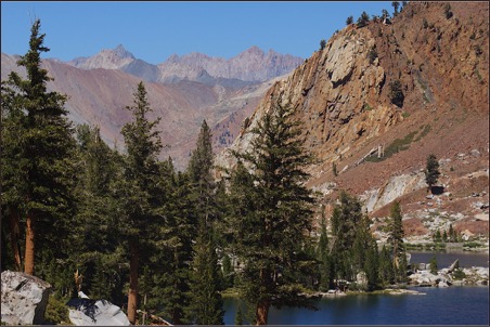 Image of a lake and rugged mountain slopes